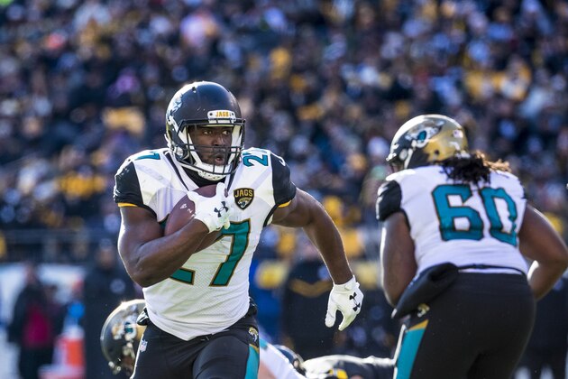 PITTSBURGH, PA - JANUARY 14: Leonard Fournette #27 of the Jacksonville Jaguars carries the ball for a touchdown originally ruled out at the 1 yard line during the AFC Divisional Playoff game against the Pittsburgh Steelers at Heinz Field on January 14, 2018 in Pittsburgh, Pennsylvania. Jaguars defeat Pittsburgh 45-42. (Photo by Brett Carlsen/Getty Images) PITTSBURGH, PA - JANUARY 14: Leonard Fournette #27 of the Jacksonville Jaguars carries the ball for a touchdown originally ruled out at the 1 yard line during the AFC Divisional Playoff game against the Pittsburgh Steelers at Heinz Field on January 14, 2018 in Pittsburgh, Pennsylvania. Jaguars defeat Pittsburgh 45-42. (Photo by Brett Carlsen/Getty Images)