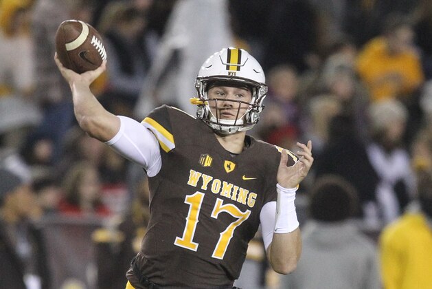 Wyoming quarterback Josh Allen (17) warms up prior to the start of an NCAA college football game in Laramie, Wyo., Saturday, Sept. 23, 2017. (AP Photo/Shannon Broderick)
