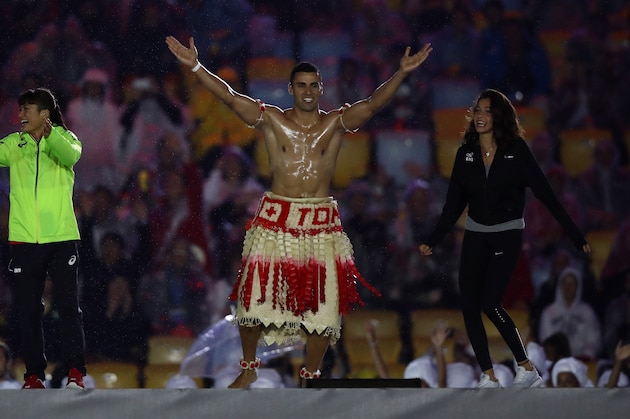 RIO DE JANEIRO, BRAZIL - AUGUST 21:  Pita Taufatofua of Tonga jumps on stage during the Closing Ceremony on Day 16 of the Rio 2016 Olympic Games at Maracana Stadium on August 21, 2016 in Rio de Janeiro, Brazil.  (Photo by Ezra Shaw/Getty Images)