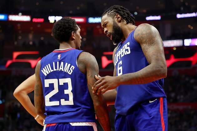 LOS ANGELES, CA - DECEMBER 31:   Lou Williams #23 of the LA Clippers and DeAndre Jordan #6 of the LA Clippers chat between points in the fourth quarter at Staples Center on December 31, 2017 in Los Angeles, California.  (Photo by Joe Scarnici/Getty Images)