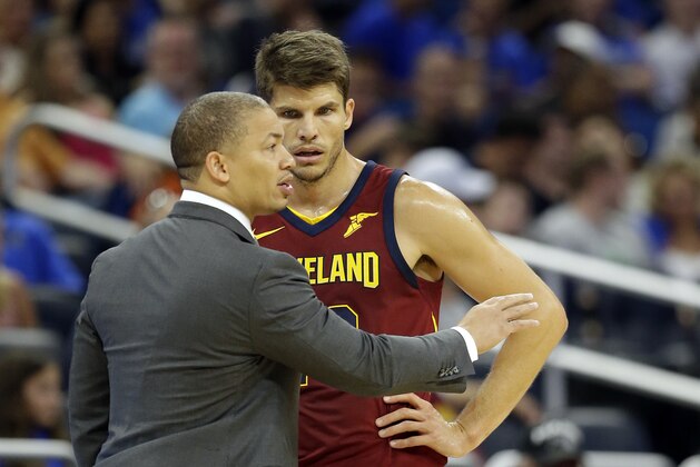 Cleveland Cavaliers head coach Tyronn Lue, left, talks with Kyle Korver during the second half of an NBA preseason basketball game against the Orlando Magic, Friday, Oct. 13, 2017, in Orlando, Fla. Cleveland won 113-106. (AP Photo/John Raoux)