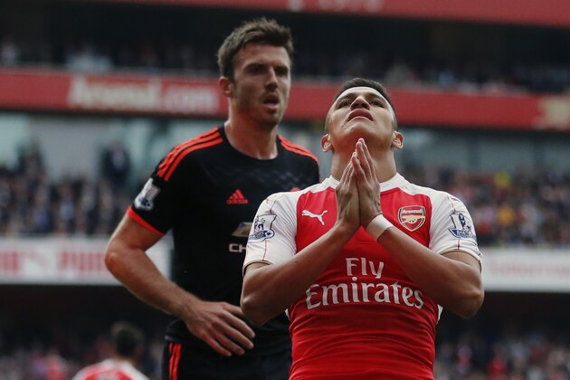 Arsenal's Alexis Sanchez reacts after missing a chance to score a goal during the English Premier League soccer match between Arsenal and Manchester United at Emirates stadium in London, Sunday, Oct. 4, 2015.(AP Photo/Frank Augstein)