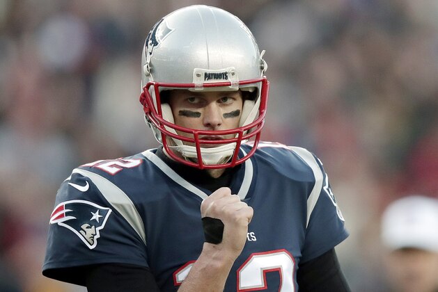New England Patriots quarterback Tom Brady pumps his fist after a touchdown run by running back James White during the first half of the AFC championship NFL football game against the Jacksonville Jaguars, Sunday, Jan. 21, 2018, in Foxborough, Mass. (AP Photo/Charles Krupa)