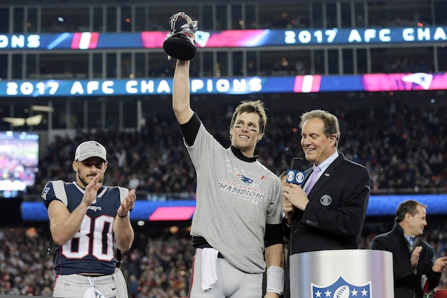 New England Patriots quarterback Tom Brady holds the AFC championship trophy after an NFL football game, Sunday, Jan. 21, 2018, in Foxborough, Mass. The Patriots won 24-20. (AP Photo/David J. Phillip)