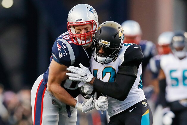 FOXBOROUGH, MA - JANUARY 21:  Rob Gronkowski #87 of the New England Patriots is hit by Barry Church #42 of the Jacksonville Jaguars in the second quarter during the AFC Championship Game at Gillette Stadium on January 21, 2018 in Foxborough, Massachusetts.  (Photo by Kevin C. Cox/Getty Images)