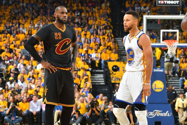 OAKLAND, CA - JUNE 4: LeBron James #23 of the Cleveland Cavaliers and Stephen Curry #30 of the Golden State Warriors looks on during the game during Game Two of the 2017 NBA Finals at Oracle Arena on June 4, 2017 in Oakland, California. NOTE TO USER: User expressly acknowledges and agrees that, by downloading and/or using this Photograph, user is consenting to the terms and conditions of the Getty Images License Agreement. Mandatory Copyright Notice: Copyright 2017 NBAE (Photo by Jesse D. Garrabrant/NBAE via Getty Images)