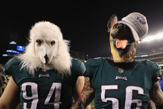 PHILADELPHIA, PA - JANUARY 21:  Beau Allen #94 and Chris Long #56 of the Philadelphia Eagles celebrates their teams win while wearing a dog masks over the Minnesota Vikings in the NFC Championship game at Lincoln Financial Field on January 21, 2018 in Philadelphia, Pennsylvania.  (Photo by Patrick Smith/Getty Images)