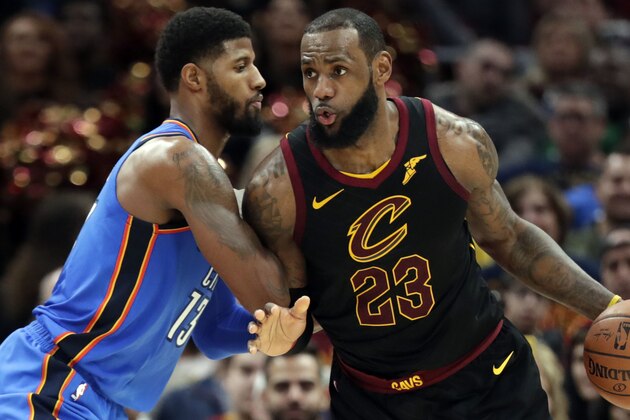 Cleveland Cavaliers' LeBron James, right, drives past Oklahoma City Thunder's Paul George in the second half of an NBA basketball game, Saturday, Jan. 20, 2018, in Cleveland. (AP Photo/Tony Dejak)