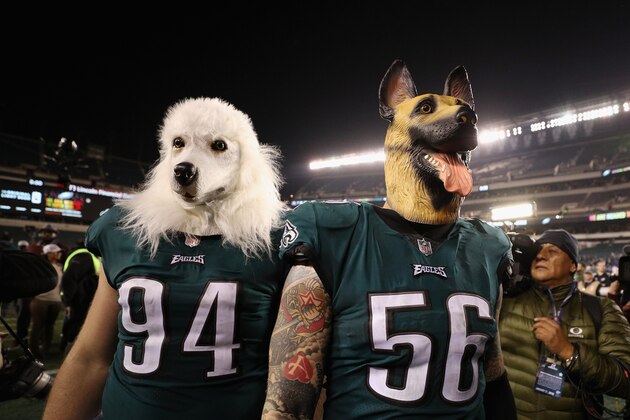 PHILADELPHIA, PA - JANUARY 21:  Beau Allen #94 and Chris Long #56 of the Philadelphia Eagles celebrates their teams win while wearing a dog masks over the Minnesota Vikings in the NFC Championship game at Lincoln Financial Field on January 21, 2018 in Philadelphia, Pennsylvania.  (Photo by Patrick Smith/Getty Images)