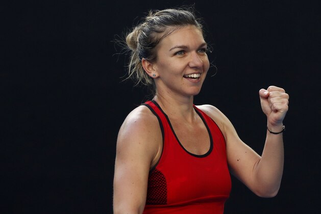 Romania's Simona Halep celebrates after defeating Japan's Naomi Osaka during their fourth round match at the Australian Open tennis championships in Melbourne, Australia, Monday, Jan. 22, 2018. (AP Photo/Ng Han Guan)
