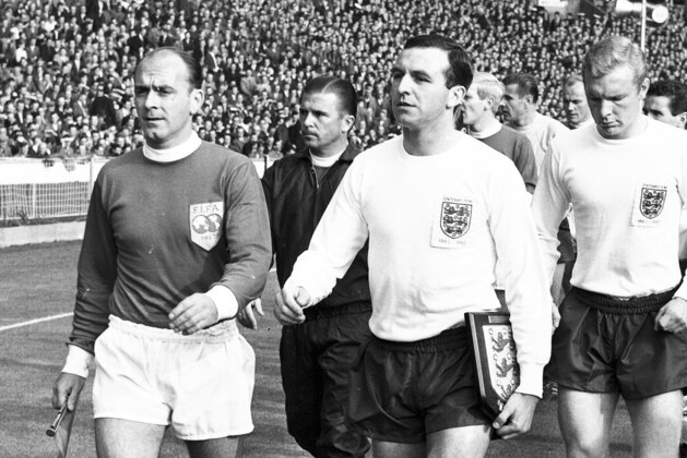 ** FILE ** Captain Alfredo Di Stefano, left, leads out the Rest of the World team and captain Jimmy Armfield leads out England, for the Football Association Centenary soccer match at Wembley Stadium, London, on in this Oct. 23, 1963 file photo.  Behind Di Stefano is Ferenc Puskas and behind Armfield is Bobby Moore. England won the match 2 - 1. Hungarian soccer great Ferenc Puskas has died in a Budapest hospital. He was 79. Puskas died Friday, Nov. 17, 2006 at 7 a.m. (0600 GMT) at the Kutvolgyi hospital of respiratory and circulatory failure, family spokesman Gyorgy Szollosy said. The captain of Hungary's