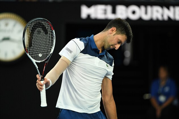 Serbia's Novak Djokovic reacts during their men's singles fourth round match against South Korea's Hyeon Chung on day eight of the Australian Open tennis tournament in Melbourne on January 22, 2018. / AFP PHOTO / SAEED KHAN / -- IMAGE RESTRICTED TO EDITORIAL USE - STRICTLY NO COMMERCIAL USE --        (Photo credit should read SAEED KHAN/AFP/Getty Images)