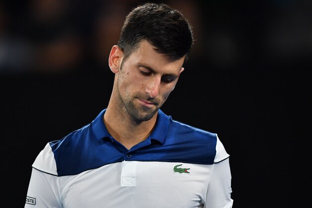 Serbia's Novak Djokovic reacts after a point against South Korea's Hyeon Chung during their men's singles fourth round match on day eight of the Australian Open tennis tournament in Melbourne on January 22, 2018. / AFP PHOTO / Paul Crock / -- IMAGE RESTRICTED TO EDITORIAL USE - STRICTLY NO COMMERCIAL USE -- (Photo credit should read PAUL CROCK/AFP/Getty Images) Serbia's Novak Djokovic reacts after a point against South Korea's Hyeon Chung during their men's singles fourth round match on day eight of the Australian Open tennis tournament in Melbourne on January 22, 2018. / AFP PHOTO / Paul Crock / -- IMAGE RESTRICTED TO EDITORIAL USE - STRICTLY NO COMMERCIAL USE -- (Photo credit should read PAUL CROCK/AFP/Getty Images)