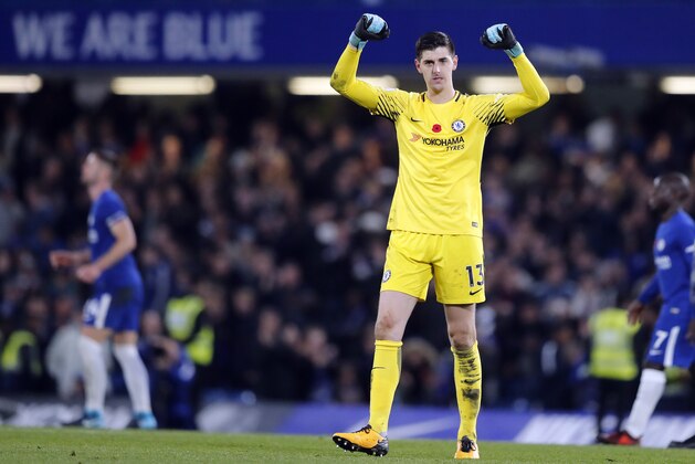 Chelsea's goalkeeper Thibaut Courtois celebrates after winning the English Premier League soccer match between Chelsea and Manchester United at Stamford Bridge stadium in London, Sunday, Nov. 5, 2017.(AP Photo/Frank Augstein)