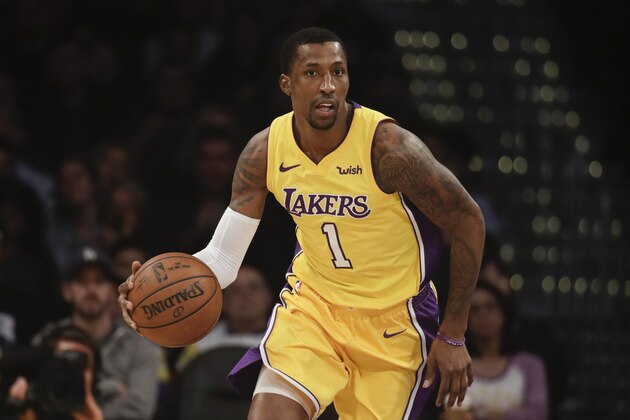 Los Angeles Lakers' Kentavious Caldwell-Pope dribbles the ball during the first half of an NBA basketball game against the San Antonio Spurs Thursday, Jan. 11, 2018, in Los Angeles. (AP Photo/Jae C. Hong)