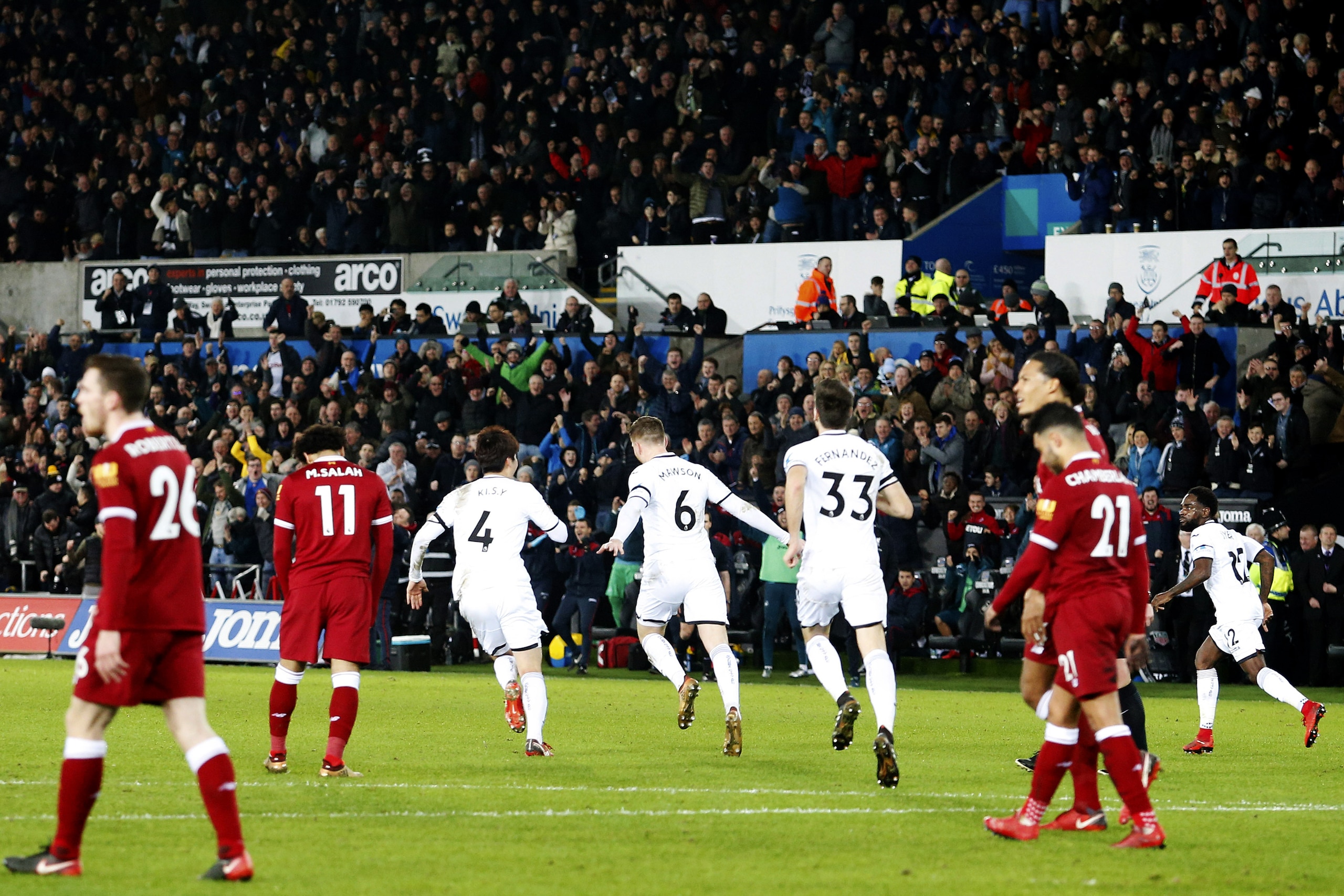 SWANSEA, WALES - JANUARY 22: Alfie Mawson of Swansea City celebrates scoring his sides first goal of the match during the Premier League match between Swansea City and Liverpool at the Liberty Stadium on January 22, 2018 in Swansea, Wales. (Photo by Athena Pictures/Getty Images) SWANSEA, WALES - JANUARY 22: Alfie Mawson of Swansea City celebrates scoring his sides first goal of the match during the Premier League match between Swansea City and Liverpool at the Liberty Stadium on January 22, 2018 in Swansea, Wales. (Photo by Athena Pictures/Getty Images)