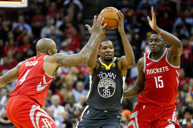 HOUSTON, TX - JANUARY 20:  Kevin Durant #35 of the Golden State Warriors attempts to get the shot off before the half as Clint Capela #15 of the Houston Rockets and PJ Tucker #4 defend at Toyota Center on January 20, 2018 in Houston, Texas. NOTE TO USER: User expressly acknowledges and agrees that, by downloading and or using this photograph, User is consenting to the terms and conditions of the Getty Images License Agreement.  (Photo by Bob Levey/Getty Images)