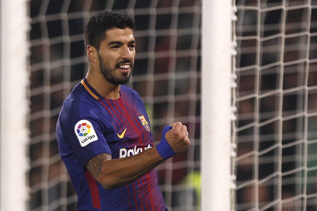 Barcelona's Suarez reacts after scoring against Betis during the La Liga soccer match between Barcelona and Betis at the Villamarin stadium, in Seville, Spain on Sunday, Jan. 21, 2018. (AP Photo/Miguel Morenatti)