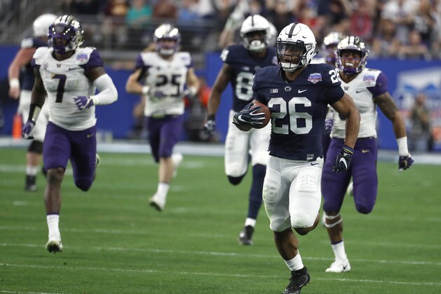 Penn State running back Saquon Barkley (26) against Washington during the Fiesta Bowl NCAA college football game, Saturday, Dec. 30, 2017, in Glendale, Ariz. (AP Photo/Rick Scuteri)