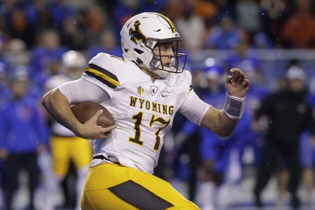 Wyoming quarterback Josh Allen (17) runs the ball during the first half of an NCAA college football game against Boise State in Boise, Idaho, Saturday, Oct. 21, 2017. (AP Photo/Otto Kitsinger)