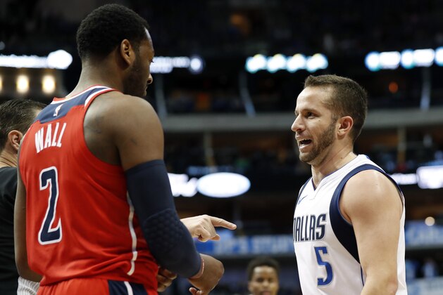 Washington Wizards' John Wall (2) and Dallas Mavericks' J.J. Barea, of Puerto Rico argue after a play in the second half of an NBA basketball game, Monday, Jan. 22, 2018, in Dallas. Barca was charged with a technical foul after the outburst between the two. (AP Photo/Tony Gutierrez)