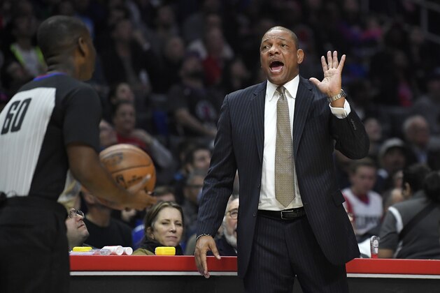 Los Angeles Clippers head coach Doc Rivers, right, complains about a foul call to referee James Williams during the first half of an NBA basketball game against the Minnesota Timberwolves, Monday, Jan. 22, 2018, in Los Angeles. Doc Rivers was ejected from the game during the second half. (AP Photo/Mark J. Terrill)