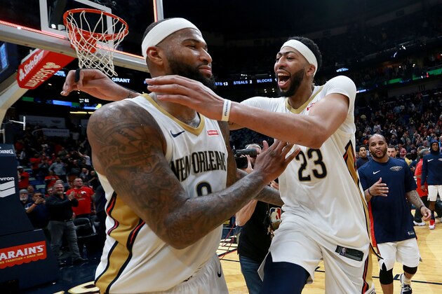 NEW ORLEANS, LA - JANUARY 22:  Anthony Davis #23 of the New Orleans Pelicans and DeMarcus Cousins #0 of the New Orleans Pelicans celebrate after defeating the Chicago Bulls 132 -128 in double overtime of a NBA game at Smoothie King Center on January 22, 2018 in New Orleans, Louisiana. NOTE TO USER: User expressly acknowledges and agrees that, by downloading and or using this photograph, User is consenting to the terms and conditions of the Getty Images License Agreement.  (Photo by Sean Gardner/Getty Images)