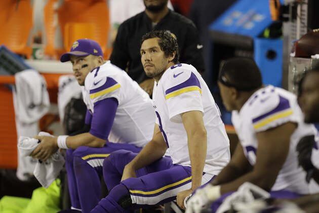 Minnesota Vikings quarterbacks Sam Bradford (8) and Case Keenum (7) sits on the bench during the second half of an NFL football against the Chicago Bears, Monday, Oct. 9, 2017, in Chicago. (AP Photo/Darron Cummings)