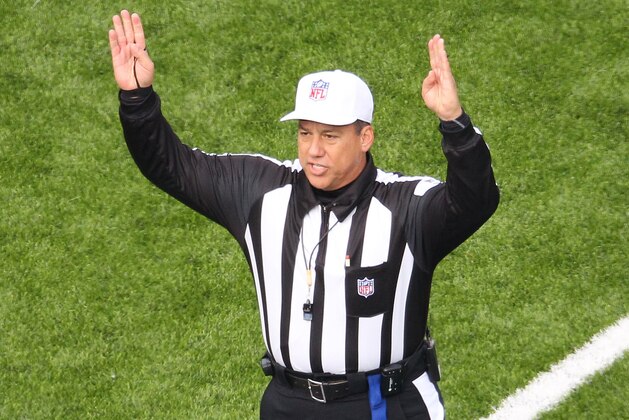 ORCHARD PARK, NY - DECEMBER 4: Referee Alberto Riveron signals a touchdown during the Tennessee Titans NFL game against the Buffalo Bills at Ralph Wilson Stadium on December 4, 2011 in Orchard Park, New York. (Photo by Tom Szczerbowski/Getty Images)