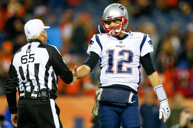 DENVER, CO - NOVEMBER 12:  Quarterback Tom Brady #12 of the New England Patriots shakes hands with referee Walt Coleman #65 as he warms up before a game against the Denver Broncos at Sports Authority Field at Mile High on November 12, 2017 in Denver, Colorado. (Photo by Justin Edmonds/Getty Images)
