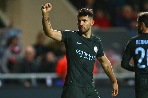 Manchester City's Argentinian striker Sergio Aguero celebrates after scoring their second goal during the English League Cup semi-final, second leg football match between Bristol City and Manchester City at Ashton Gate Stadium in Bristol, south-west England on January 23, 2018. / AFP PHOTO / Geoff CADDICK / RESTRICTED TO EDITORIAL USE. No use with unauthorized audio, video, data, fixture lists, club/league logos or 'live' services. Online in-match use limited to 75 images, no video emulation. No use in betting, games or single club/league/player publications.  /         (Photo credit should read GEOFF CADDICK/AFP/Getty Images)