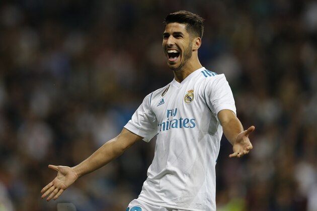 Real Madrid's Marco Asensio celebrates after scoring his side's second goal against Eibar during the Spanish La Liga soccer match between Real Madrid and Eibar at the Santiago Bernabeu stadium in Madrid, Sunday, Oct. 22, 2017. (AP Photo/Francisco Seco)