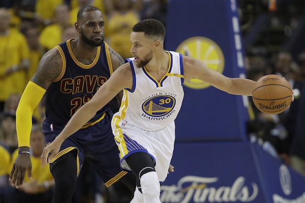 Golden State Warriors guard Stephen Curry (30) is guarded by Cleveland Cavaliers forward LeBron James during the second half of Game 1 of basketball's NBA Finals in Oakland, Calif., Thursday, June 1, 2017. (AP Photo/Marcio Jose Sanchez)