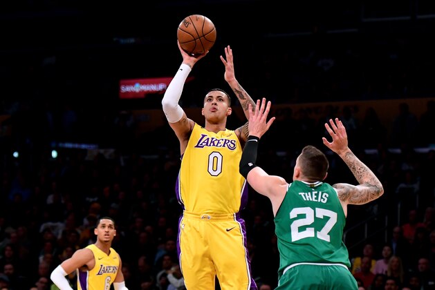 LOS ANGELES, CA - JANUARY 23:  Kyle Kuzma #0 of the Los Angeles Lakers scores on a jumper over Daniel Theis #27 of the Boston Celtics during the first half at Staples Center on January 23, 2018 in Los Angeles, California.  (Photo by Harry How/Getty Images)