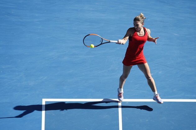MELBOURNE, AUSTRALIA - JANUARY 24:  Simona Halep of Romania plays a forehand in her quarter-final match against Karolina Pliskova of the Czech Republic on day 10 of the 2018 Australian Open at Melbourne Park on January 24, 2018 in Melbourne, Australia.  (Photo by XIN LI/Getty Images)