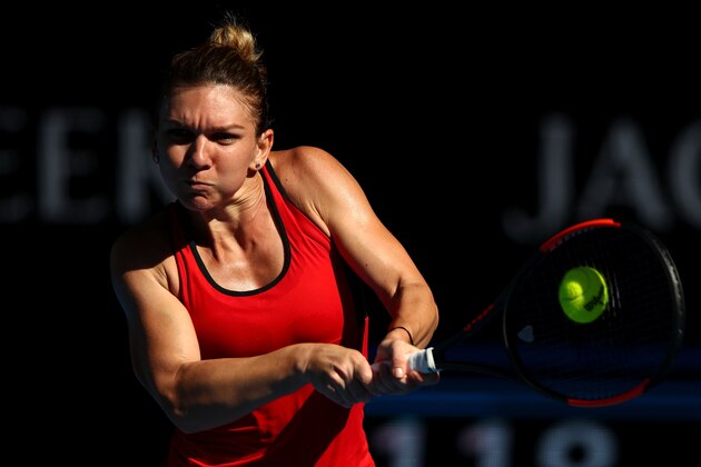 MELBOURNE, AUSTRALIA - JANUARY 24:  Simona Halep of Romania plays a backhand in her quarter-final match against Karolina Pliskova of the Czech Republic on day 10 of the 2018 Australian Open at Melbourne Park on January 24, 2018 in Melbourne, Australia.  (Photo by Clive Brunskill/Getty Images)
