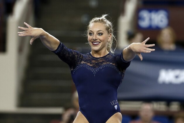 UCLA's Samantha Peszek competes on the balance beam during the NCAA women's gymnastics championships Sunday, April 19, 2015, in Fort Worth, Texas. (AP Photo/Tony Gutierrez)