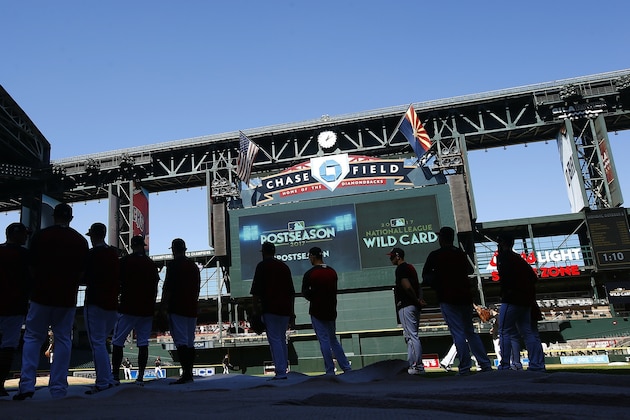 Arizona Diamondbacks players gets ready for fielding drills during a workout at Chase Field, Monday, Oct. 2, 2017, in Phoenix, as the team gets ready for a National League wild card playoff baseball game. The Diamondbacks host the Colorado Rockies on Wednesday. (AP Photo/Ross D. Franklin)