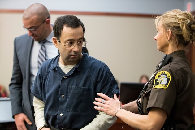 Former USA Gymnastics doctor Larry Nassar is about to be led away following his sentencing hearing in Lansing, Michigan, January 16, 2018.
Victims of sexual abuse by Nassar delivered gut-wrenching emotional testimony at the court hearing which could see him sentenced to prison for life. Nassar has been accused of molesting more than 100 female athletes during the three decades he worked with USA Gymnastics and at Michigan State University. / AFP PHOTO / Geoff Robins        (Photo credit should read GEOFF ROBINS/AFP/Getty Images)
