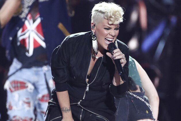 FILE - In this Sept. 22, 2017, file photo, Pink performs at the 2017 iHeartRadio Music Festival Day 1 held at T-Mobile Arena in Las Vegas. NFL announced Monday, Jan. 8, 2018, that the pop star will perform “The Star-Spangled Banner” before the Big Game on Feb. 4 at U.S. Bank Stadium in Minneapolis. (Photo by John Salangsang/Invision/AP, File)