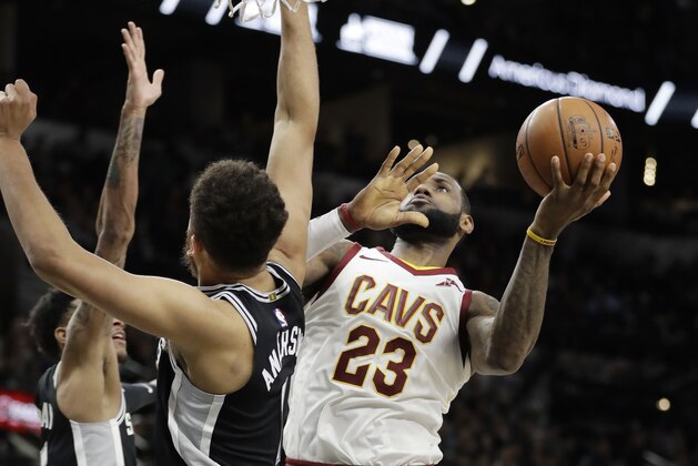 Cleveland Cavaliers forward LeBron James (23) shoots over San Antonio Spurs forward Kyle Anderson (1) during the first half of an NBA basketball game against the San Antonio Spurs, Tuesday, Jan. 23, 2018, in San Antonio. James entered the game needing seven points to hit the 30,000 mark for career points; James scored 28 points. (AP Photo/Eric Gay)