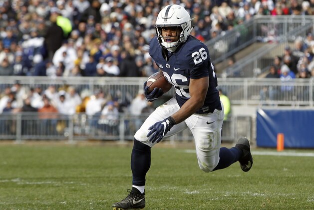 Penn State's Saquon Barkley (26) runs the ball against Rutgers during the second half of an NCAA college football game in State College, Pa., Saturday, Nov. 11, 2017. Penn State 35-6. (AP Photo/Chris Knight)