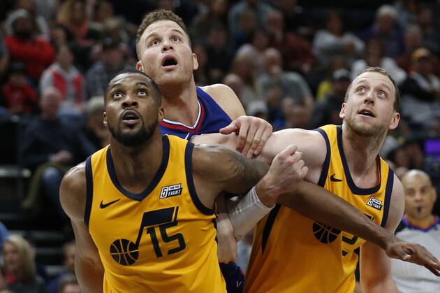 Los Angeles Clippers forward Blake Griffin, rear, battle under the boards with Utah Jazz's Derrick Favors (15) and Joe Ingles (2) in the first half during an NBA basketball game Saturday, Jan. 20, 2018, in Salt Lake City. (AP Photo/Rick Bowmer)