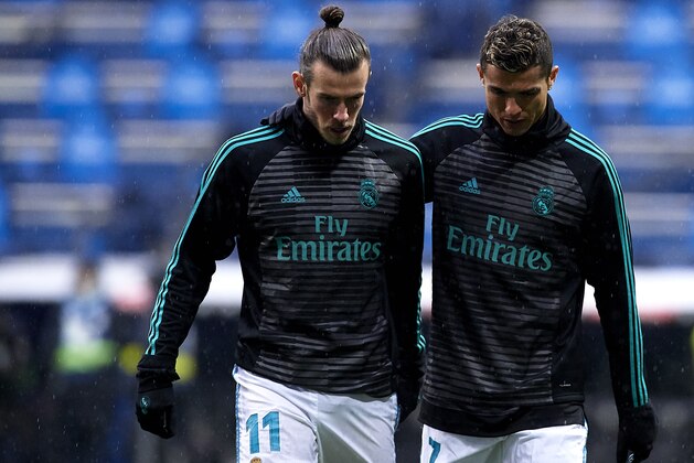 MADRID, SPAIN - JANUARY 13:  Cristiano Ronaldo (R) of Real Madrid and his teammate Gareth Bale warm up during the La Liga match between Real Madrid and Villarreal at Estadio Santiago Bernabeu on January 13, 2018 in Madrid, Spain.  (Photo by fotopress/Getty Images)