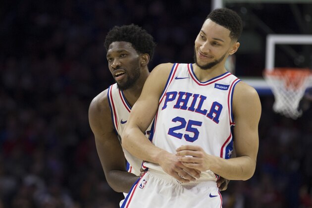 PHILADELPHIA, PA - DECEMBER 2: Joel Embiid #21 and Ben Simmons #25 of the Philadelphia 76ers react after Dario Saric made a basket and was fouled in the second quarter against the Detroit Pistons at the Wells Fargo Center on December 2, 2017 in Philadelphia, Pennsylvania. NOTE TO USER: User expressly acknowledges and agrees that, by downloading and or using this photograph, User is consenting to the terms and conditions of the Getty Images License Agreement. (Photo by Mitchell Leff/Getty Images)