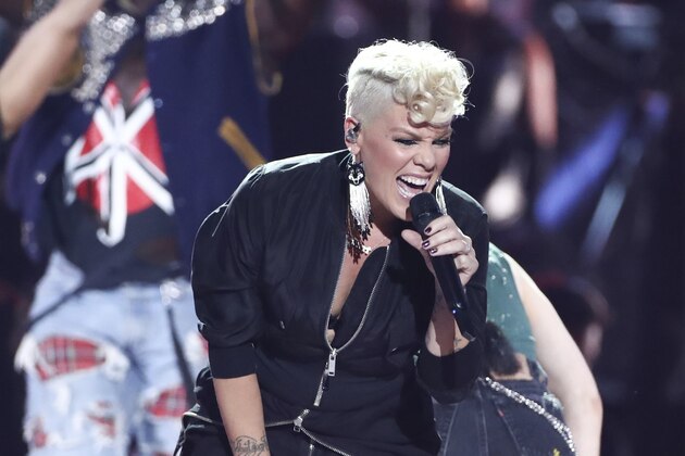FILE - In this Sept. 22, 2017, file photo, Pink performs at the 2017 iHeartRadio Music Festival Day 1 held at T-Mobile Arena in Las Vegas. Pink is joining the list of stars performing in Minneapolis during Super Bowl week. The singer will perform Friday, Feb. 2, 2018, at Nomadic Live! in the refurbished Minneapolis Armory building.(Photo by John Salangsang/Invision/AP, File)