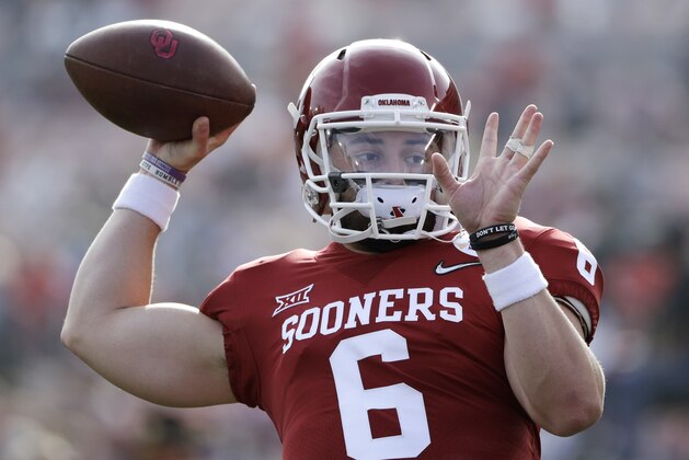 Oklahoma quarterback Baker Mayfield passes during warmups before the Rose Bowl NCAA college football game against Georgia, Monday, Jan. 1, 2018, in Pasadena, Calif. (AP Photo/Gregory Bull)