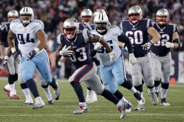 New England Patriots running back Dion Lewis (33) carries the ball against the Tennessee Titans during the first half of an NFL divisional playoff football game, Saturday, Jan. 13, 2018, in Foxborough, Mass. (AP Photo/Steven Senne)