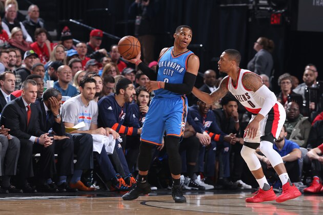 PORTLAND, OR - DECEMBER 13:  Russell Westbrook #0 of the Oklahoma City Thunder handles the ball against Damian Lillard #0 of the Portland Trail Blazers during the game on December 13, 2016 at the Moda Center in Portland, Oregon. NOTE TO USER: User expressly acknowledges and agrees that, by downloading and or using this Photograph, user is consenting to the terms and conditions of the Getty Images License Agreement. Mandatory Copyright Notice: Copyright 2016 NBAE (Photo by Sam Forencich/NBAE via Getty Images)
