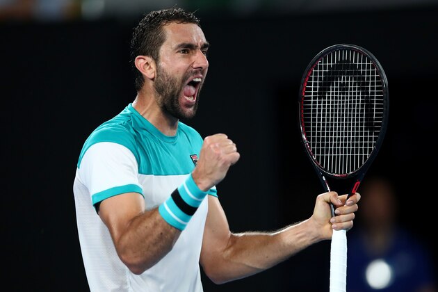 MELBOURNE, AUSTRALIA - JANUARY 25:  Marin Cilic of Croatia celebrates winning the second set in his semi-final match against Kyle Edmund of Great Britain on day 11 of the 2018 Australian Open at Melbourne Park on January 25, 2018 in Melbourne, Australia.  (Photo by Clive Brunskill/Getty Images)